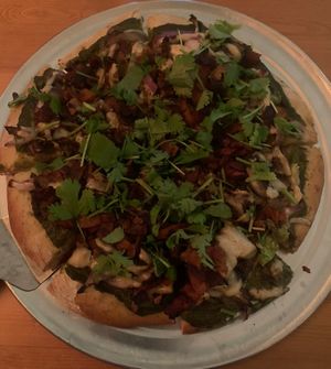 This is the Animal Lover pizza which was HUGE! Definitely enough to split between two.   at El Grifo in Caguas