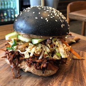 Vegan banh mi. They ran out of rolls so they served it up with buns. Still tasted amazing! at The Merri in Preston