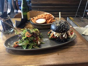 Sweet potato fries, salad and the vegan BBQ burger. The one of the staff recommended this for dinner. Very happy I went with this option! Tasted so darn good! at The Merri in Preston