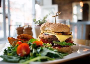 Ultimate Vegan Burger!
Roasted sweet potatoes, mixed beans, scallions, roasted peppers and coriander burger topped with grilled pineapple, vegan cheese  and homemade spicy ketchup and vegan mayo
 at Miranda Cafe in North London