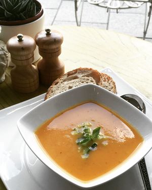 Cool Tomato and carrots Gazpacho for the summer topped with cucumber and mint! at Miranda Cafe in North London