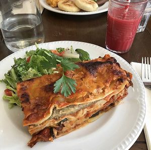 Vegan lasagne and ‘Violet C’ juice (beetroot, carrot, orange)  at Miranda Cafe in North London
