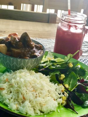 Mushroom Stew - basmati rice and salad with a Watermelon and Strawberry juice.  One of the daily specials which vary every week.  at Sweet and Blue in Willemstad