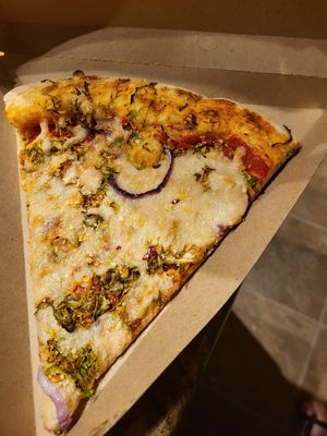 Red onion Brussels pizza slice at Whole Foods Market in Cedar Park