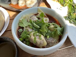 Chili Oil Wontons: vegan pork dumplings in our infamous sweet and tangy chili oil sauce  at Jade Rabbit in Portland