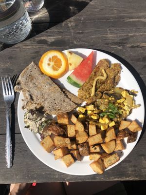 Complete vegan breakfast: fruits, curry tofu, veg pate, fauxcheese, potatoes, gluten-free option: the buckwheat crepe! DELICIOUS! Great service & dog friendly on the terrace 💚  at L'Innocent in Riviere-du-loup