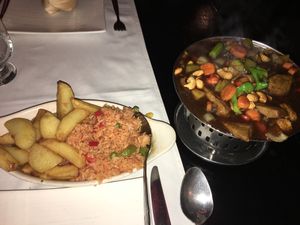 If you order in.. food comes on a sizzling tray with the fire still burning under it.  at Rose Garden in Willemstad