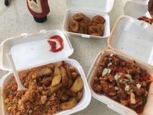 sweet and sour veggie chicken.. fried rice and potaoes with fried banana (plantain) at Rose Garden in Willemstad