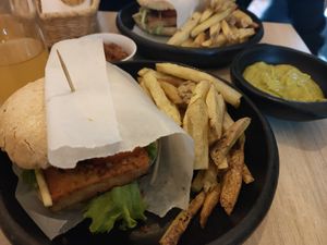 Tofu burger and fries. Also comes with guacamole dip and drink at La Madriguera Consciente in Bogota
