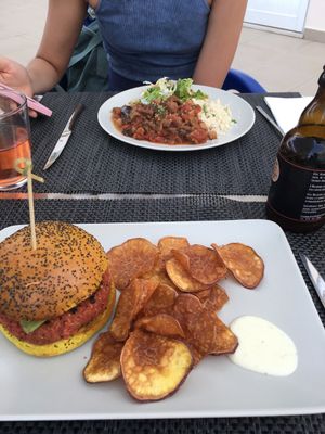 My burger and girlfriend's stew :)  at Veggie Cafe in Albufeira