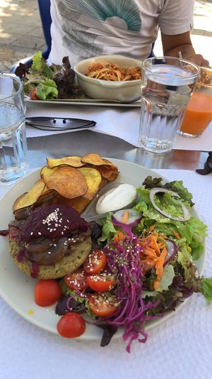Spaghetti Bolo and a Veggieburger (without bread) with delicious crisps and salad at Veggie Cafe in Albufeira