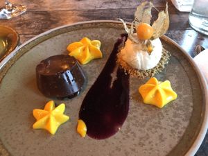 Dark chocolate ganache with mango mousse and vanilla ice cream  at Pakkhus in Hofn I Hornafirdi