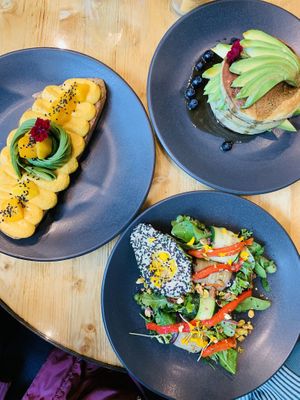 Curry hummus with avocado, pancake with maplesyrup and blueberrys, avocado with greens.  at The Avocado Show - Stalpertstraat in Amsterdam