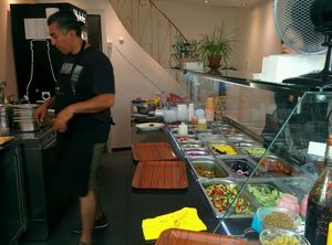 making our amazing falafel wrap at Za Zaa Barfi - Gerbergasse in Basel