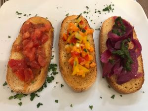 Traditional bruschetta tomatoes, mixed veggies and caramelised tangy onion  at Trattoria Di Mirko in Alghero