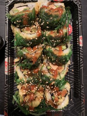 Vegan San Diego Roll (in: tofu, gobo carrots, avocado, asparagus. top: whole roll tempura battered & deep fried, topped with seaweed salad, sweet sauce, sriracha & sesame seeds ) at Sushi 2 in San Diego