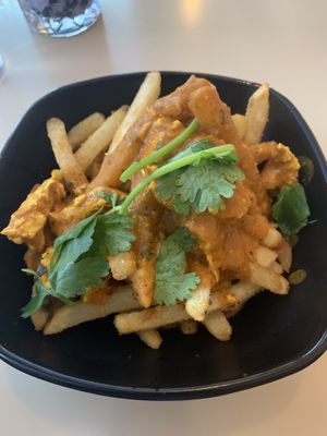 Butter chicken with fries  at Saigon Lotus in Toronto