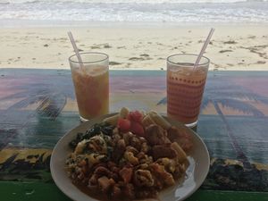 Breakfast platter included lots of variety: potatoes, plantains, plaintain fritters, fresh fruit, ackee, callaloo, bean stew. Pictured with fresh mango juice and fruit punch (punch comes from a good amount of ginger!) at Rasta Ade Refreshments in Negril