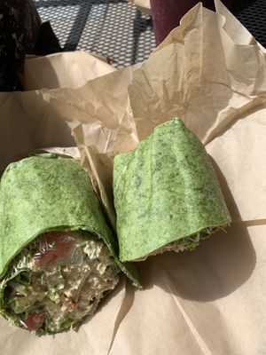 Veggie hummus wrap on a spinach wrap at Lolo Kai Smoothies & Wraps in Galveston