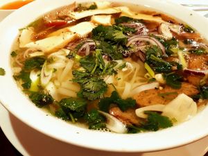 strong vegetable broth with rice noodles at Amitabha in Prague