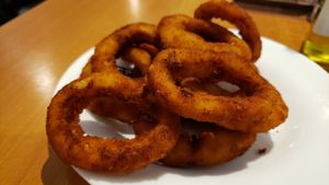 Onion rings (R$16). Weirdly bland and under-salted. at Pop Vegan Food in Sao Paulo