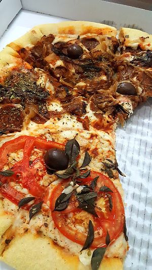 Vegan pizza delivery (temperoni and marguerita) at Pop Vegan Food in Sao Paulo