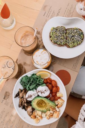 Avo Toast, Mango + Coconut Chia (vg) / Brekkie bowl(minus bacon)+haloumi  at Bowl in Mykonos