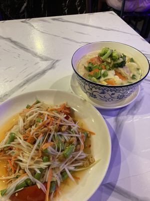 Tom kha (coconut soup) and som tam (papaya salad). Both delicious, especially the soup. Salad not spicy unfortunately   at Dow Vegan Restaurant in Koh Phi Phi