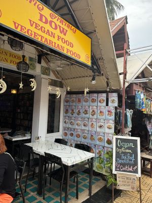 Menu on the walls outside, books on the shelves inside   at Dow Vegan Restaurant in Koh Phi Phi
