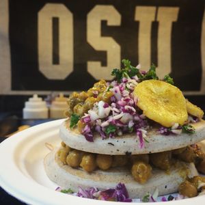 Aunt Patricia... one of the savory pancakes made with coconut base, Caribbean style chickpeas/pumpkin curry, plantain and home made coleslaw. at OSU Coconuts in London