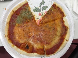 Three kinds of cheese pizza at Pizzeria La Faina in Malaga