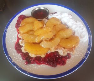 Vegan Belgian Waffles: Warm cinnamon apples, Berry compote, whipped cream & maple syrup at The Koffee Pot in Manchester