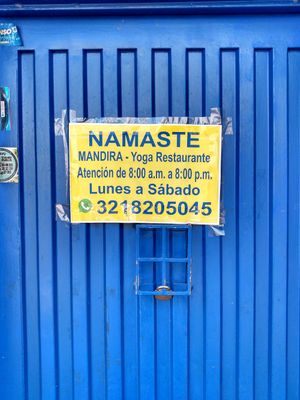 Info sign on door at Mandira in Pereira