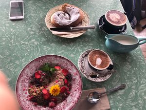Cinnamon swirl, granola bowl and two cappuccino   at Portershed in Christchurch