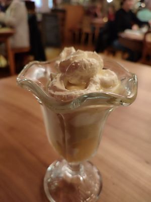 Vanilla ice cream with applesauce, whipped cream and vegan Eierlikör at Blume Wollbach in Kandern