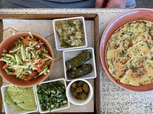 Vegan breakfast with chickpea omelette  at Nimrod Cafe - Port in Tel Aviv