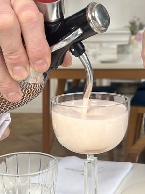 Serving alcohol free appetizer   at Humus x Hortense in Brussels