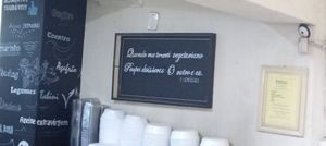 "Quando me torrnei vegetariano, poupei dois seres: o outro e eu" (Hemógenes) [um dos quadros presentes no restaurante] at Vita Natural in Sao Paulo