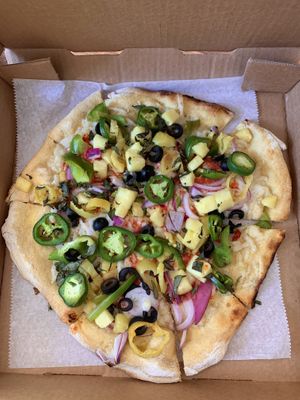 Loaded pizza with vegan cheese  at Cherokee Brewing + Pizza Company in Dalton