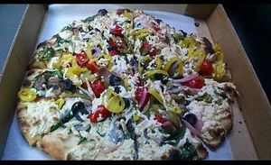 Veggie pizza with vegan cheese at Cherokee Brewing + Pizza Company in Dalton