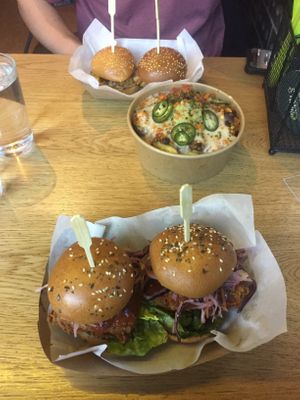 Vegan chick’n burger, vegan chilli fries, meat burger of a friend at Token in Dublin