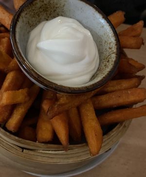 Sweet potato fries and vegan mayo  at +84 Asian Restaurant in Berlin