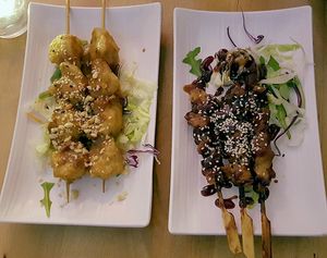Left: vegan "chicken" on skewers with peanut sauce (Chicken Satee). Right: real chicken version. at +84 Asian Restaurant in Berlin