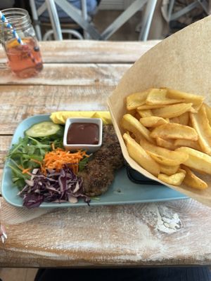 Seitan pepper steak with BBQ sauce and chips  at Veggiezz - Opernring in Vienna
