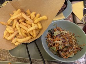 Stir fried/sautéed veggies with a side of chips  at Veggiezz - Opernring in Vienna