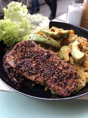 Pepper seitan steak with pumpkin quinotto, caramelizes onions and avocado at Veggiezz - Opernring in Vienna
