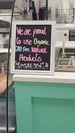 lovely colorful sign displayed by the food.  at Blend Cups Organic in Hackensack