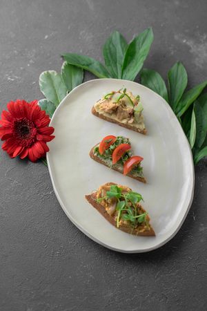 Vegan assorted bruschetta with fermented cheese, tomato, herb and tempo at Verde Cafe in Moscow