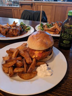 seitan burger (with seitan meatballs in the background) at The Judgy Vegan in Brussels