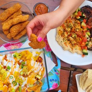 big loaded nacho dish with loads of other food at The Judgy Vegan in Brussels